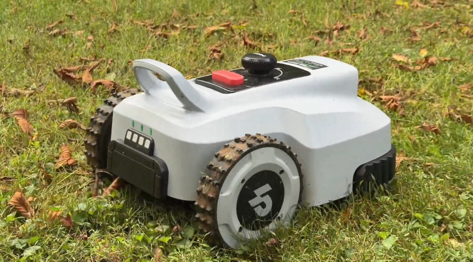 Side profile of the Lopkin L2500 robot mower showing its large rear drive wheel, status lights and carry handle