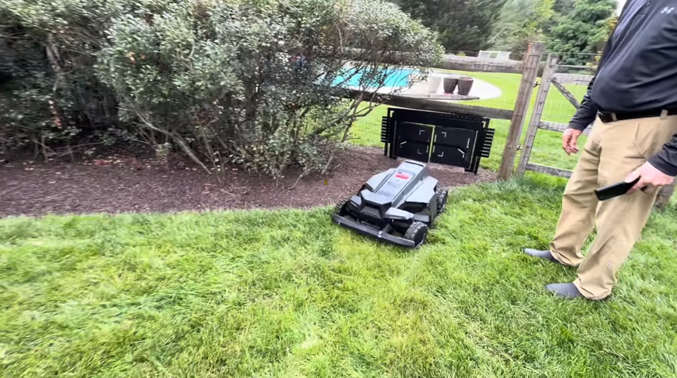 A Navimow X430 passing through a narrow gate between two mapped zones