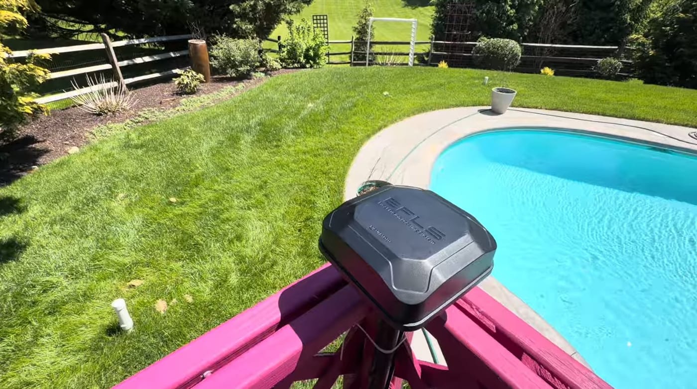 A Segway Navimow EFLS RTK antenna installed outdoors with a clear, open view of the sky over a lawn