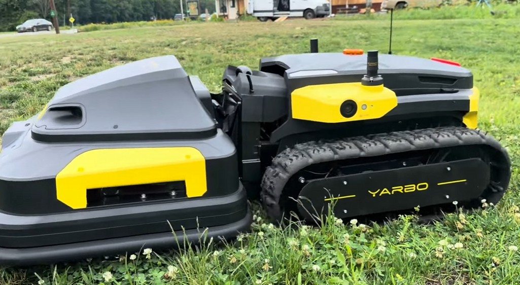 The Yarbo M Series tracked Core beside its snap-on mower module