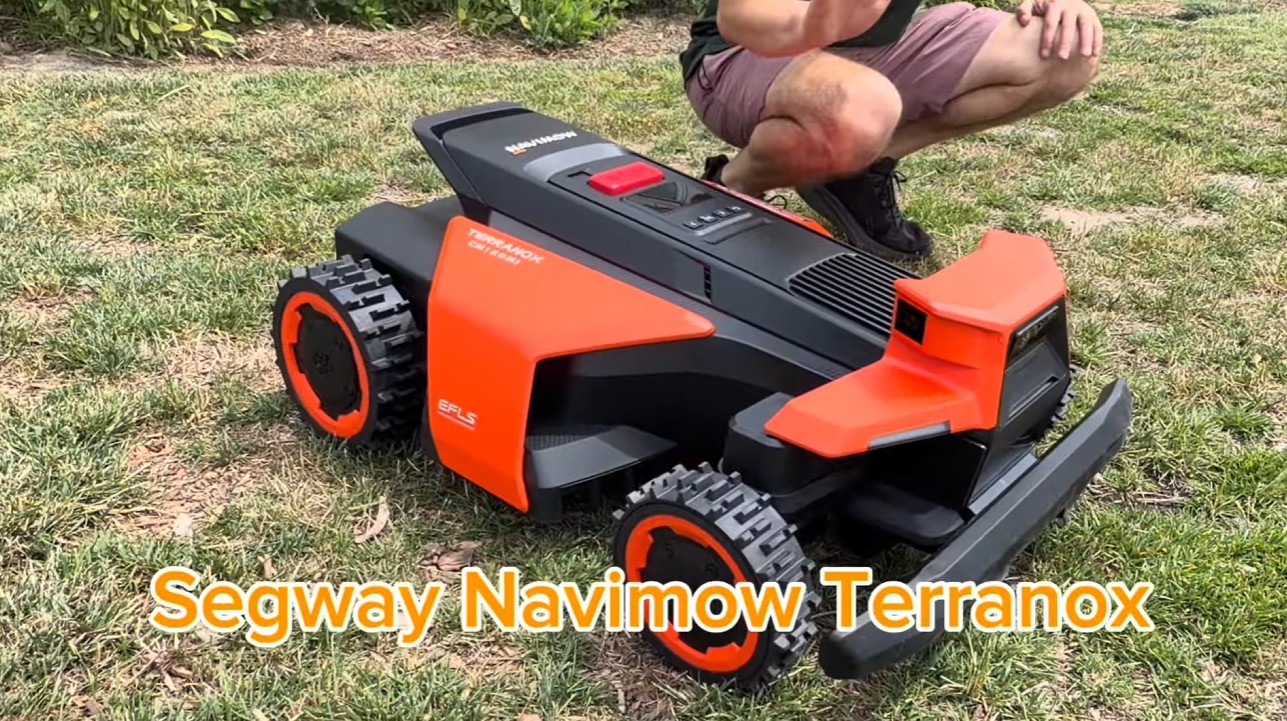 A Segway Navimow being mapped and set up on a lawn via the app