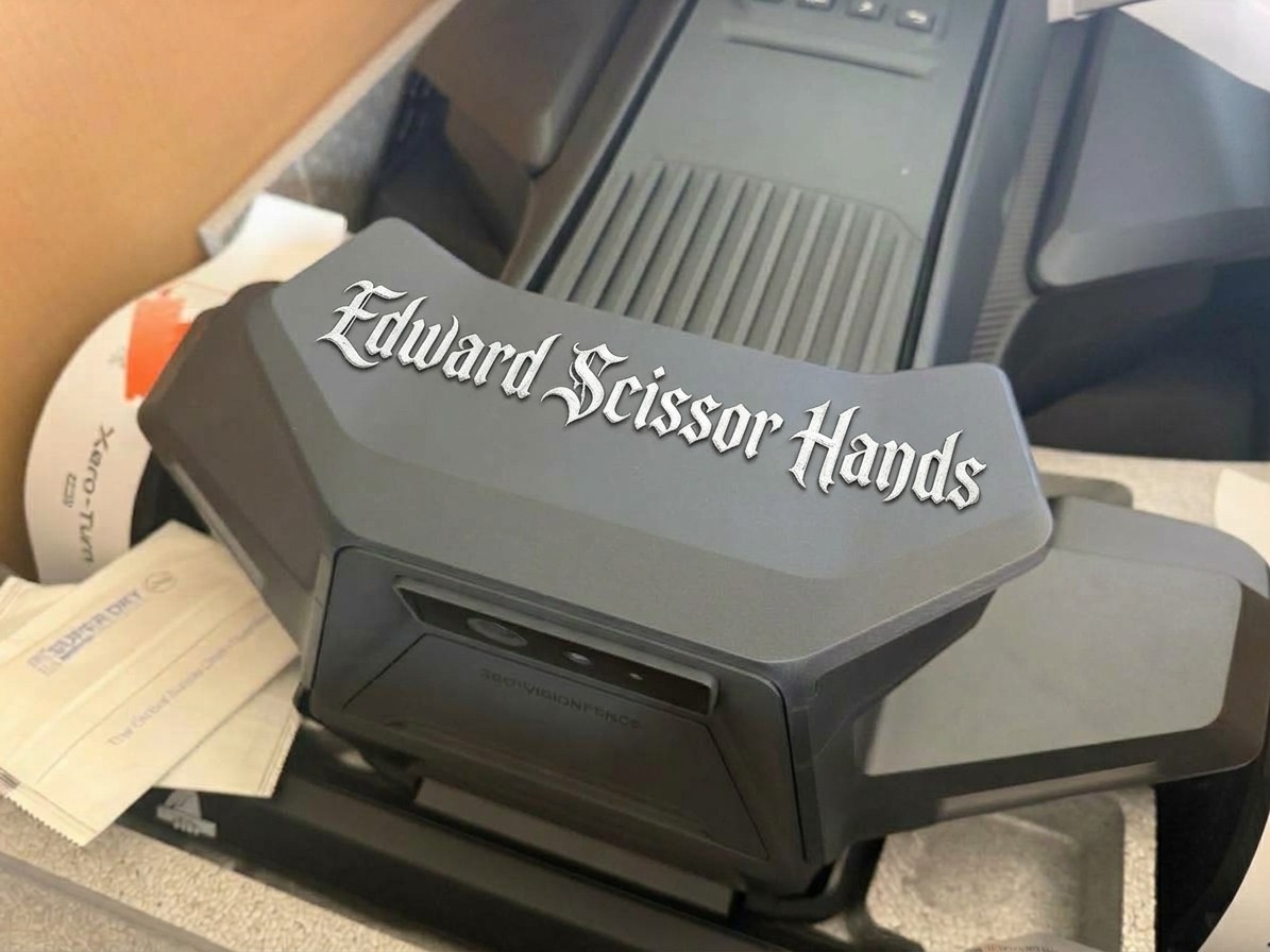 A custom Navimow nameplate reading “Edward Scissor Hands” in gothic lettering on the X4's camera housing