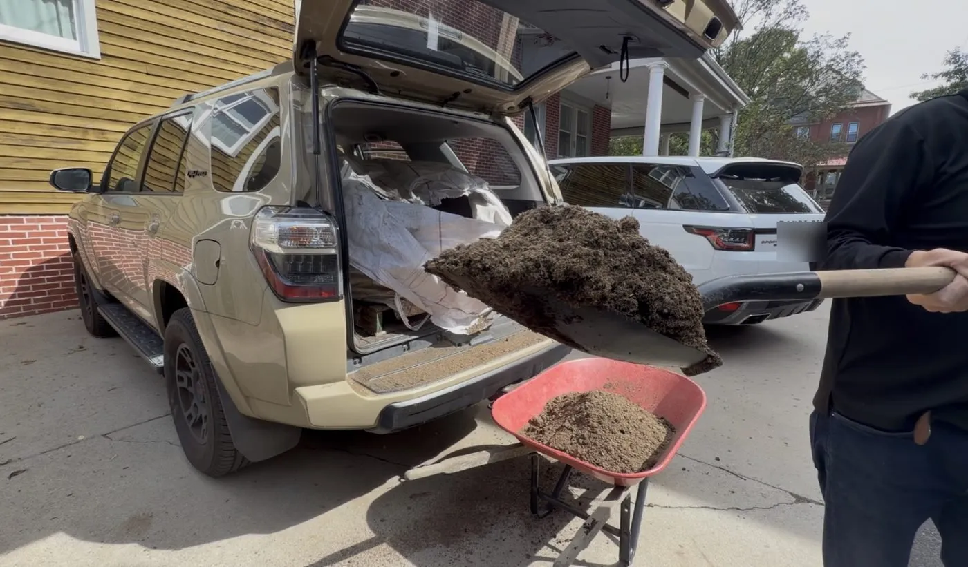 A close-up of dark, crumbly Organic Lawn Builder compost