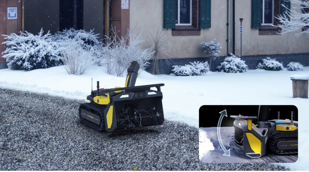 The Yarbo Snow Blower working an actual gravel driveway, with the auger intake raised to skim above the stones