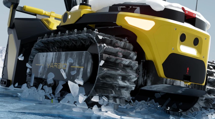 Close-up of the Yarbo's tracks fitted with traction spikes for grip on snow and ice